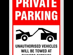 Private parking unauthorized vehicles will be towed at owner's expense